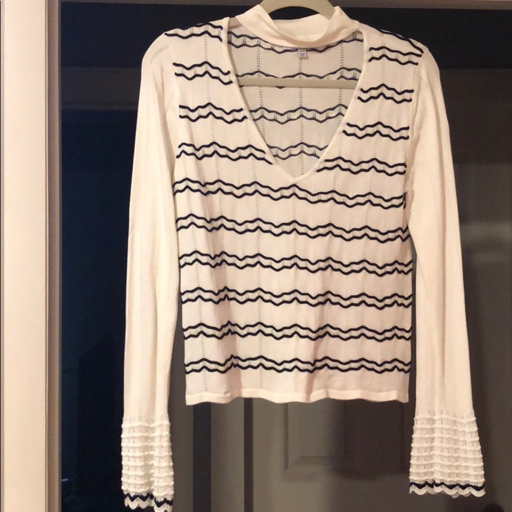 White and black top.